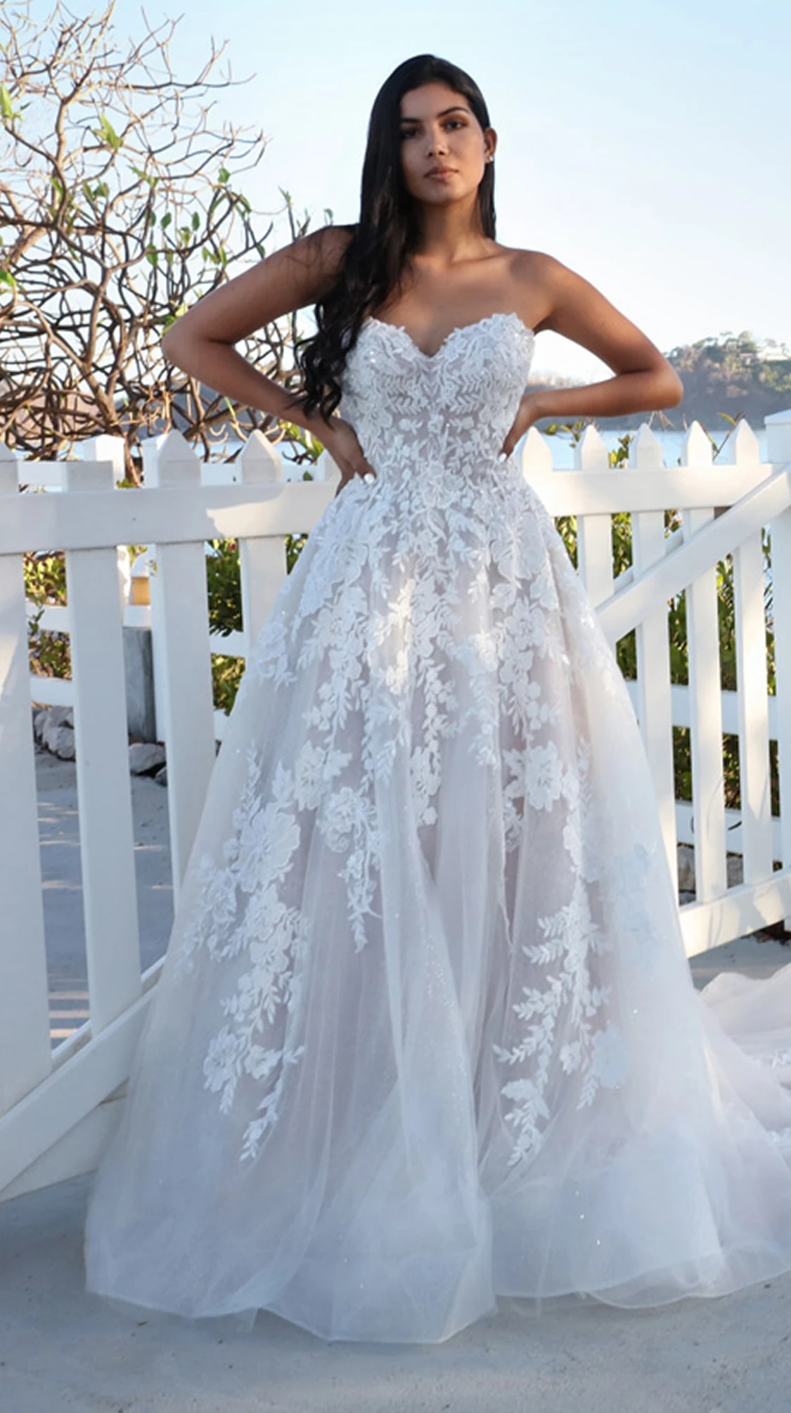 Model wearing a Bridal collection Dress by Flora